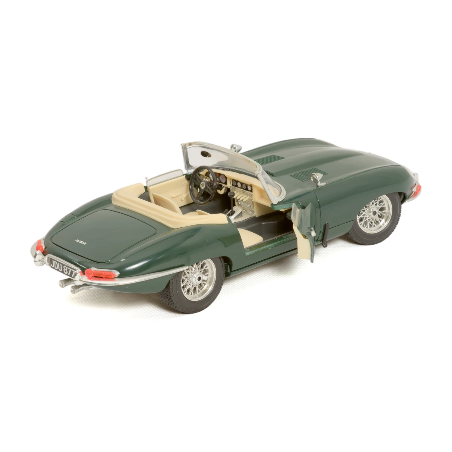 Miniature Bburago Jaguar E-Type 1/18 vue arrière avec portière ouverte et intérieur beige