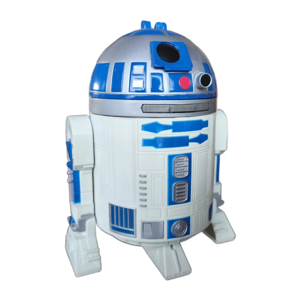 Tirelire R2-D2 Star Wars vue de trois quarts sur une table en bois