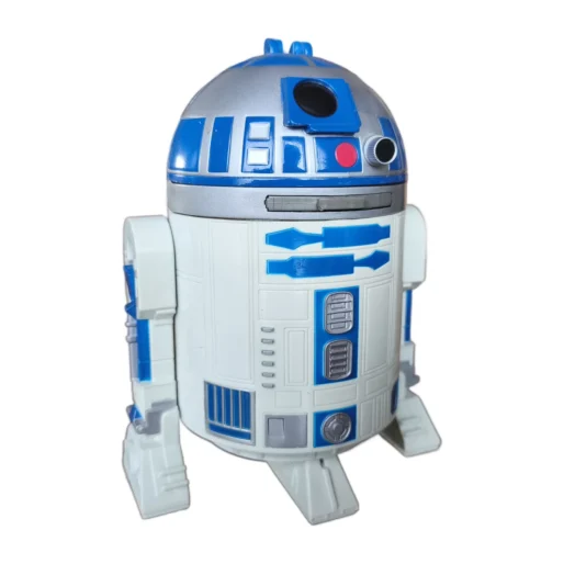 Tirelire R2-D2 Star Wars vue de trois quarts sur une table en bois