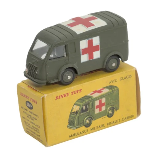 Miniature Dinky Toys 80 F Renault Carrier Ambulance Militaire posée sur sa boîte d'origine jaune