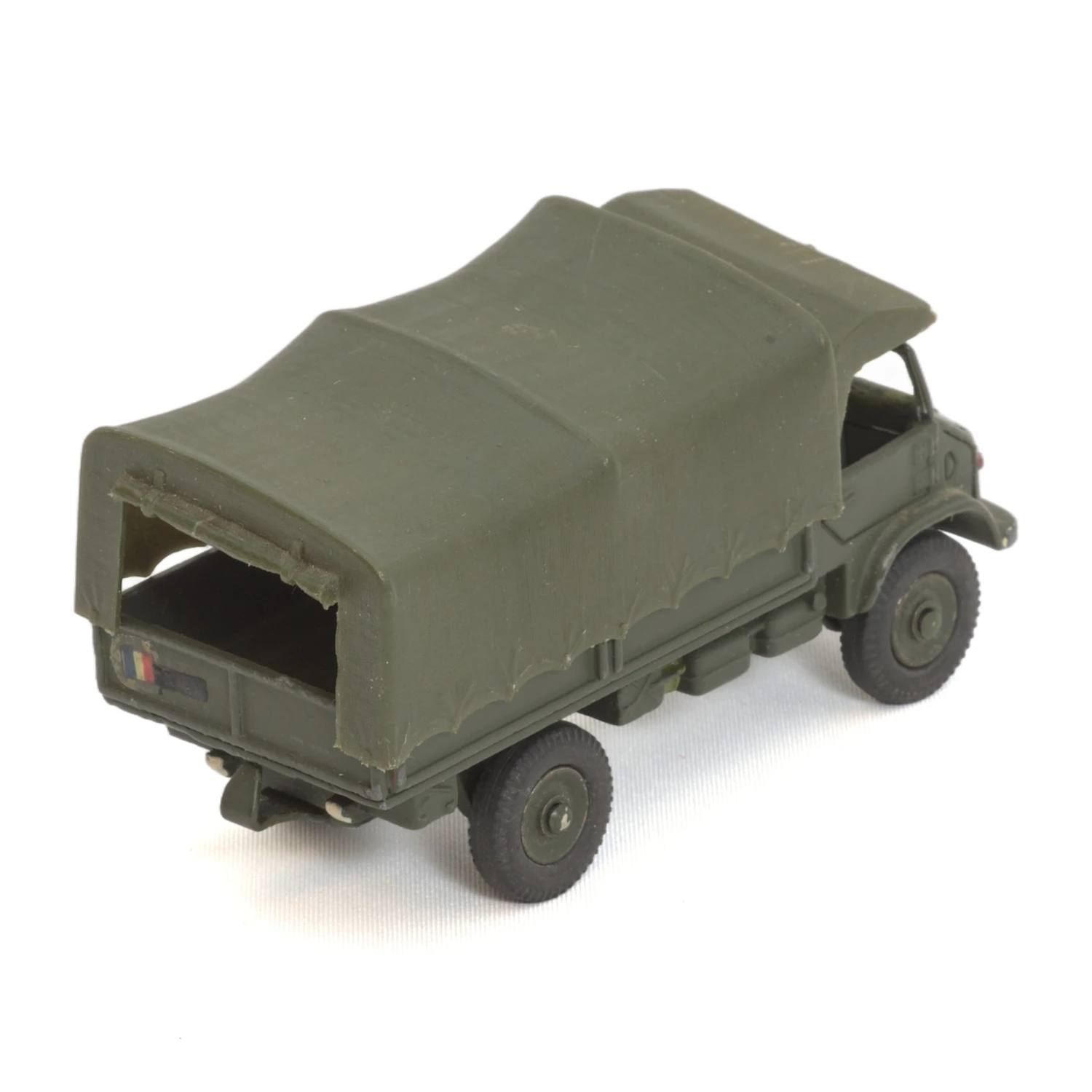 Vue arrière du camion Dinky Toys Unimog avec sa bâche en plastique vert et décalcomanie
