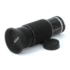 Objectif Nikon Zoom-NIKKOR 80-200mm f/4 AI-S avec pare-soleil et bouchon