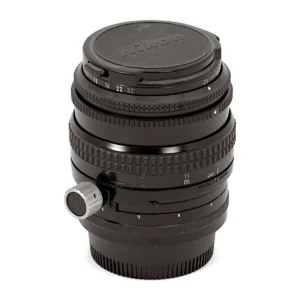 Objectif Nikon PC-Nikkor 35mm f/2.8 vu de face avec son bouchon d'origine