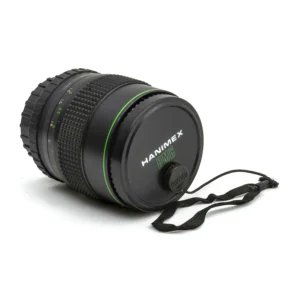 Objectif Hanimex HMC 135mm f/2.8 avec son bouchon avant
