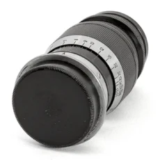Objectif Leica Ernst Leitz Wetzlar Elmar 9cm f/4 de côté avec bouchon