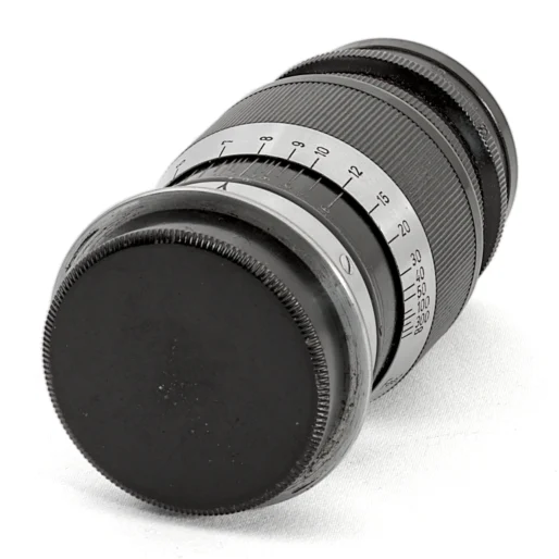 Objectif Leica Ernst Leitz Wetzlar Elmar 9cm f/4 de côté avec bouchon