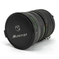 Objectif photo vintage Auto Makinon MC 28-80mm avec son bouchon avant d'origine noir